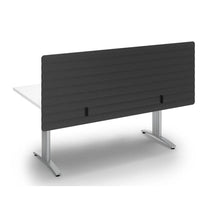 Load image into Gallery viewer, Dark grey acoustic modesty panel with wave design, mounted to the back of a desk, sitting above and below the desk to create extra privacy