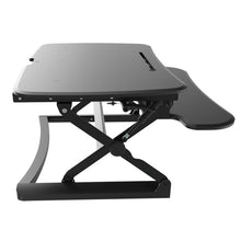 Load image into Gallery viewer, A black desk top raiser to convert a standard desk to a standing desk NZ