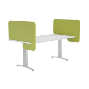 Apple green acoustic desk dividers mounted to the sides of a desk  creating a sound and privacy barrier between workers
