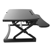 Load image into Gallery viewer, A black desk top raiser to convert a standard desk to a standing desk NZ

