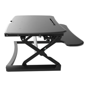 A black desk top raiser to convert a standard desk to a standing desk NZ