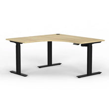 Load image into Gallery viewer, Electric sit stand corner workstation with oak look top and black legs 
